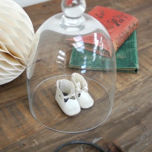 Glass cloche with vintage shoes