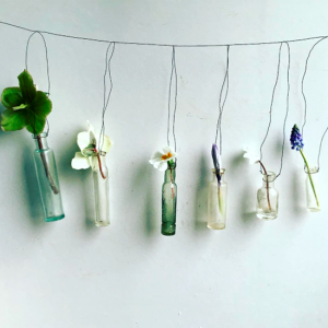 Glass bottles hanging with wire