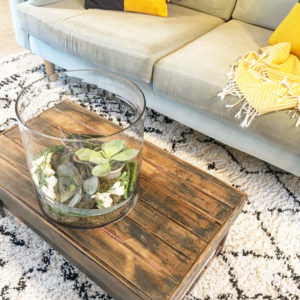 Large Glass Hurricane vase on coffee table