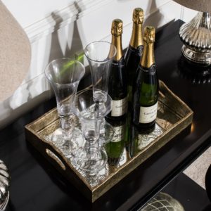 Champagne and flutes on decorative tray