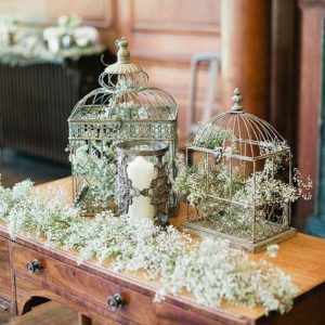 Foliage in bird cages wedding decor
