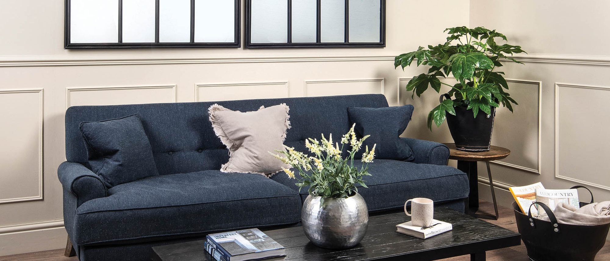 Living room with sofa, mirror and coffee table