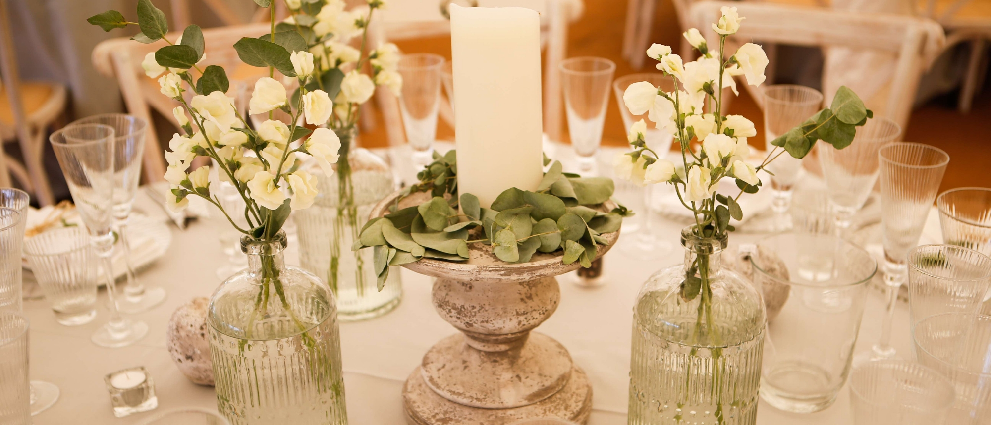 Wedding table decor with candles and glassware