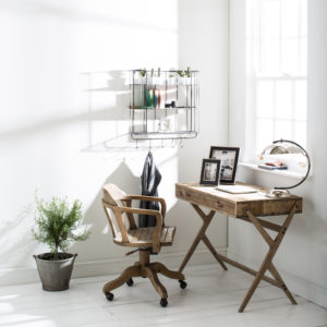 Pine desk with chair, photo frames by a window 
